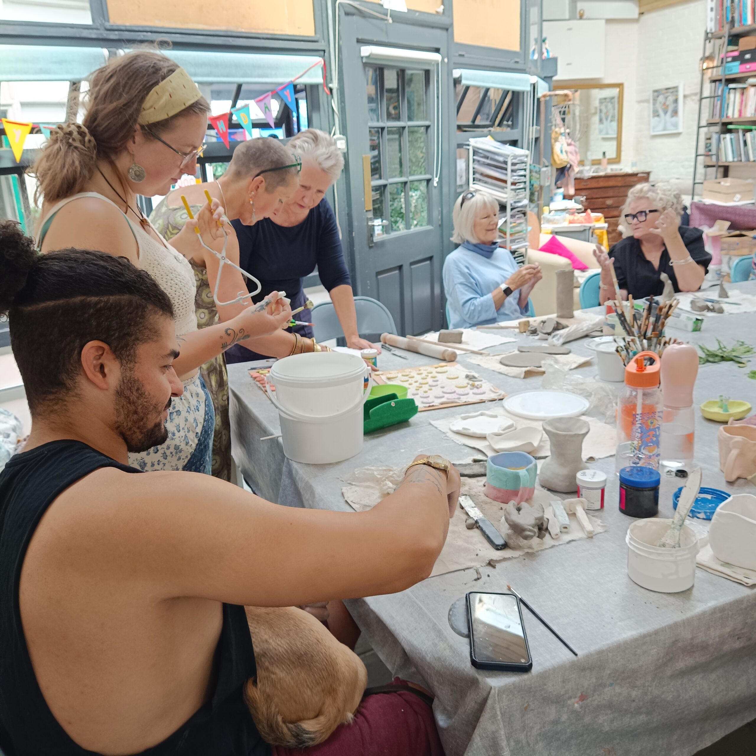 People having fun at a pottery workshop
